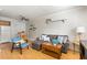 Inviting living area featuring a comfortable gray sofa, bright blue chair, and stylish decor at 2494 Etiwan Ave # 12J, Charleston, SC 29414