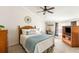 Cozy main bedroom featuring a comfortable bed, natural light, and a ceiling fan at 2494 Etiwan Ave # 12J, Charleston, SC 29414