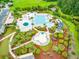 Aerial view showcasing a community pool, lush landscaping, and various recreational areas with water slide at 2972 Riverwood Dr, Mount Pleasant, SC 29466