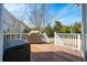 Back deck featuring wood floors, white railings, and grill providing an outdoor space for grilling at 2972 Riverwood Dr, Mount Pleasant, SC 29466