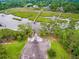 Aerial view of community boat ramp surrounded by lush greenery and a marsh landscape at 2972 Riverwood Dr, Mount Pleasant, SC 29466