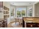 Inviting breakfast nook with lots of natural light and stylish artwork at 2972 Riverwood Dr, Mount Pleasant, SC 29466