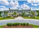 Clubhouse exterior shows a beautiful lawn and circular driveway leading up to the front entrance with a stone facade at 2972 Riverwood Dr, Mount Pleasant, SC 29466