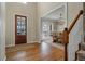 Warm and inviting foyer features hardwood floors, a staircase, and views into the dining at 2972 Riverwood Dr, Mount Pleasant, SC 29466