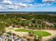Aerial view of the golf course surrounded by lush greenery and neighborhood homes at 2972 Riverwood Dr, Mount Pleasant, SC 29466