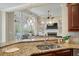 Open kitchen view with granite countertops and modern pendant lighting at 2972 Riverwood Dr, Mount Pleasant, SC 29466