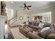 Spacious living room with a large sectional sofa, ceiling fan, and elegant decor at 2972 Riverwood Dr, Mount Pleasant, SC 29466