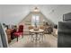 Bright sitting area featuring a small table, two red chairs, a white shuttered window, and a refrigerator at 2972 Riverwood Dr, Mount Pleasant, SC 29466