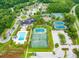 Aerial view of the community tennis courts with lush landscaping and parking area at 2972 Riverwood Dr, Mount Pleasant, SC 29466