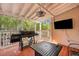 Covered back porch featuring a grill, seating, ceiling fan, and a television at 3009 Macbeth Creek Dr, Charleston, SC 29414