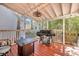 Covered back porch featuring a grill, seating, ceiling fan, and string lights at 3009 Macbeth Creek Dr, Charleston, SC 29414