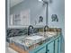 This bathroom features a unique granite double vanity and plenty of mirror space at 3009 Macbeth Creek Dr, Charleston, SC 29414