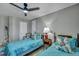 This bedroom features 2 twin beds with floral pillows and a ceiling fan at 3009 Macbeth Creek Dr, Charleston, SC 29414