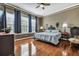 Bedroom with hardwood floors, large windows, bed, and side tables at 3009 Macbeth Creek Dr, Charleston, SC 29414