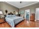 Spacious bedroom features hardwood floors, natural light, and attached bathroom at 3009 Macbeth Creek Dr, Charleston, SC 29414