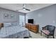 This bedroom features a TV, ceiling fan, and a patterned comforter at 3009 Macbeth Creek Dr, Charleston, SC 29414