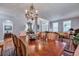 Elegant dining room featuring a chandelier, wooden table, and decorative furnishings at 3009 Macbeth Creek Dr, Charleston, SC 29414