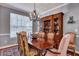 Elegant dining room with a chandelier, china cabinet, and seating for eight at 3009 Macbeth Creek Dr, Charleston, SC 29414