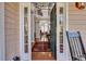 Grand foyer featuring an open doorway, hardwood floors, and a view of the staircase at 3009 Macbeth Creek Dr, Charleston, SC 29414