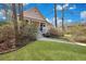 Well-maintained front yard with mature trees, a lush lawn, and a charming facade at 3009 Macbeth Creek Dr, Charleston, SC 29414