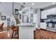 Bright kitchen with a granite-topped island, staircase access, and modern appliances at 3009 Macbeth Creek Dr, Charleston, SC 29414