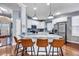 Kitchen featuring an island with granite countertops, stainless steel appliances, and white cabinetry at 3009 Macbeth Creek Dr, Charleston, SC 29414
