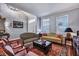 Well-decorated living room with classic furniture, area rugs, and abundant natural light at 3009 Macbeth Creek Dr, Charleston, SC 29414