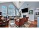 Bright living room with vaulted ceiling, large arched window and fireplace at 3009 Macbeth Creek Dr, Charleston, SC 29414