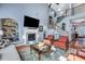 Inviting living room with fireplace, TV, staircase and adjacent built-in shelving at 3009 Macbeth Creek Dr, Charleston, SC 29414