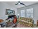 This office features dual monitors, a ceiling fan, and a large window with natural light at 3009 Macbeth Creek Dr, Charleston, SC 29414