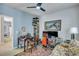 This office features a floral sofa, dual monitors, a ceiling fan, and a desk at 3009 Macbeth Creek Dr, Charleston, SC 29414