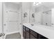 Bathroom featuring a dark wood vanity with a white countertop, framed mirror, and a shower/tub combo at 3042 Moonlight Dr, Charleston, SC 29414