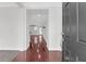 Warm and inviting foyer with hardwood floors leading to an open living area at 3042 Moonlight Dr, Charleston, SC 29414