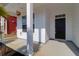 Covered front porch with black front door at 3042 Moonlight Dr, Charleston, SC 29414