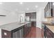 Bright kitchen features an island with granite countertop and stainless steel appliances at 3042 Moonlight Dr, Charleston, SC 29414