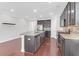 Modern kitchen featuring stainless steel appliances, granite counters, and dark wood cabinets at 3042 Moonlight Dr, Charleston, SC 29414