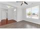 Open-concept living room with luxury vinyl plank flooring, natural light, and an open doorway at 3042 Moonlight Dr, Charleston, SC 29414