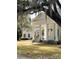 Charming home featuring a classic white exterior with grand columns and inviting entrance at 3102 Hailey Ct, McClellanville, SC 29458