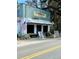 Charming storefront of T. W. Graham & Co. Seafood Restaurant with rocking chairs at 3102 Hailey Ct, McClellanville, SC 29458