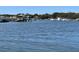 Scenic waterfront view featuring docks, boats, and tranquil blue waters in a serene setting at 3102 Hailey Ct, McClellanville, SC 29458