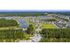 Aerial view of the neighborhood with a scenic lake and wooded areas at 315 Pine Crest View Dr, Summerville, SC 29486