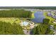 Aerial view of a neighborhood community pool and playground near a lake at 315 Pine Crest View Dr, Summerville, SC 29486