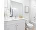 Clean white bathroom with a white vanity, a large mirror, and a shower over the tub at 315 Pine Crest View Dr, Summerville, SC 29486