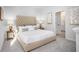 Elegant bedroom with a tufted headboard, soft carpet, and lots of natural light at 315 Pine Crest View Dr, Summerville, SC 29486