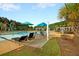 Relaxing community pool area featuring a hammock, lounge chairs and landscaping at 315 Pine Crest View Dr, Summerville, SC 29486