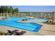 A community pool with zero entry, seating, a splash pad, and pergolas at 315 Pine Crest View Dr, Summerville, SC 29486