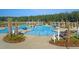 A community pool with zero entry, seating, a splash pad, and pergolas at 315 Pine Crest View Dr, Summerville, SC 29486