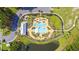 Bird's eye view of neighborhood community pool with splash pad, and playground at 315 Pine Crest View Dr, Summerville, SC 29486