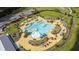 Overhead view of a luxurious community pool with a splash pad and seating at 315 Pine Crest View Dr, Summerville, SC 29486