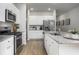 Modern kitchen with stainless steel appliances, granite countertops, and ample cabinet space at 315 Pine Crest View Dr, Summerville, SC 29486